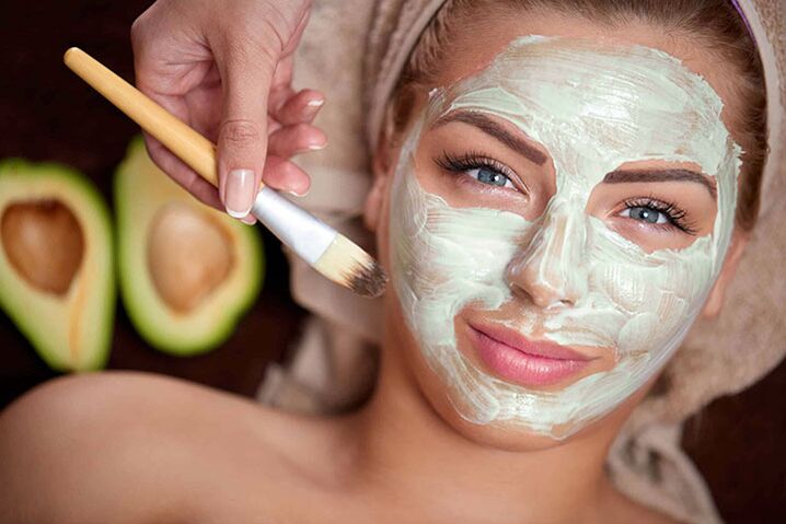 Applying a mask on the face for rejuvenation at home