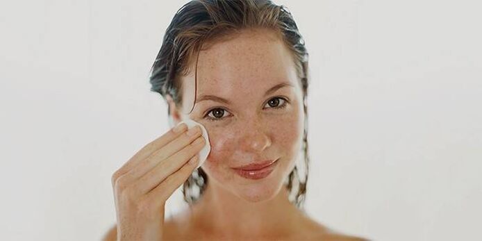 applying oil on the skin of the face for rejuvenation